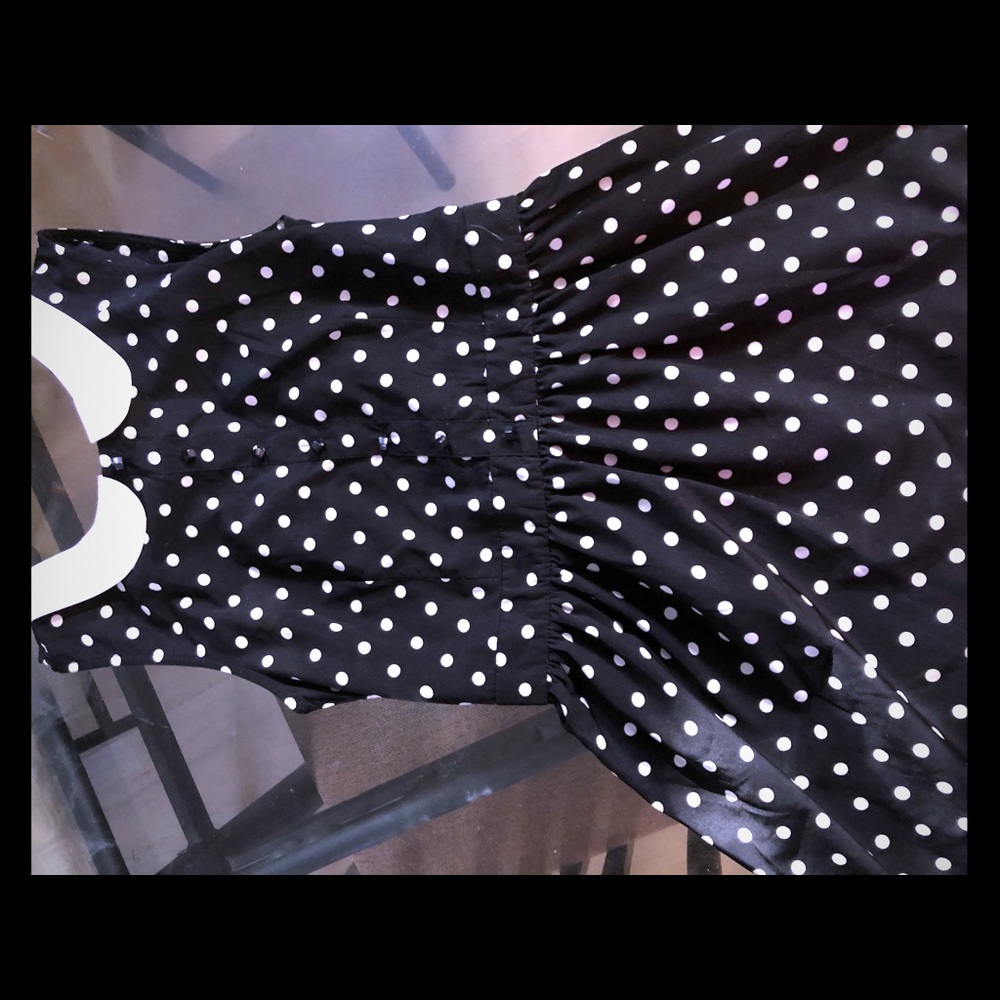A black dress with white polka dots